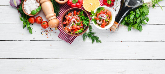 salsa sauce and ingredients. Latin American Mexican Traditional Sauce. Top view. On a white wooden...