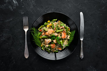Risotto with chicken fillet and vegetables. Rice. Top view. Free copy space.