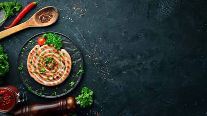 Grilled sausages with spices and herbs. BBQ Top view. Free space for your text.