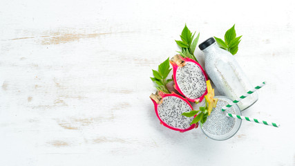 Fresh smoothies from a dragon fruit and chia seeds on a white background. Top view. Free space for text.