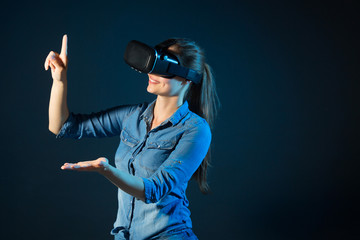 beautiful young woman wearing virtual reality glasses	