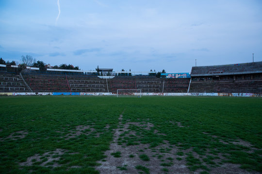 Abadoned Stadion Za  Luzankami is a currently inactive stadium in Brno, Czech Republic. Captured in spring sunset, sky and clouds was colored to blue dark colors. Photo from tribunes and inside middle