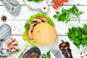 Vegetarian burger with mushrooms and vegetables. Breakfast. Top view. Free space for your text.