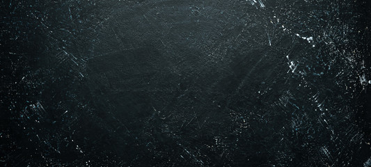 Black stone background. Top view. Free space for your text.