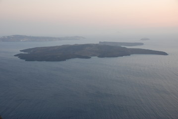 The volcano of Fira at Sunset as seen from the Santorini Island