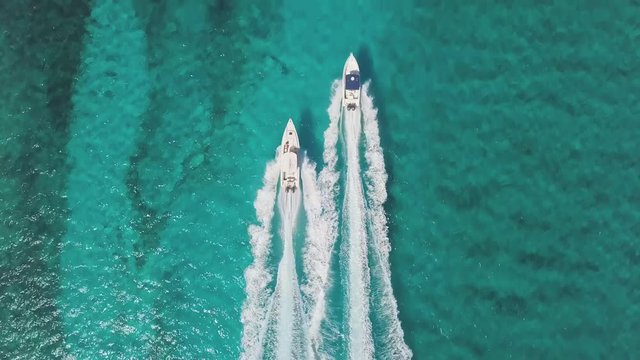 drone bird view of 2 boats in the bahamas. summer vaction