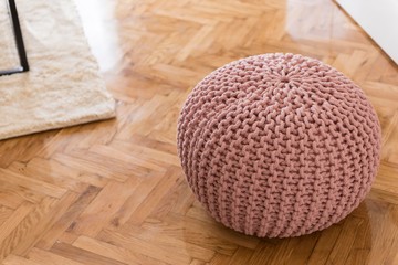 knitted tabure pillow in room. modern furniture tabouret