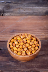 Roasted Chick Peas healthy snack on wooden table