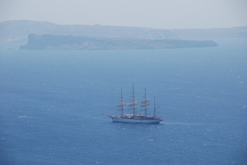 Ship sailing off the coast of Santorini Island