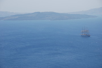 Ship sailing off the coast of Santorini Island