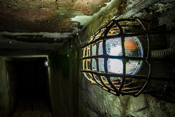 Shabby walls and a lantern in a prison corridor in the most terrible prison in Russia
