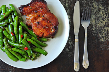 Pork steak and string beans. Keto diet. Paleo diet. Pegan Diet.