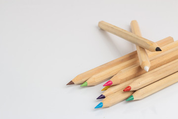 Obraz premium Colored pencils lies on a white background