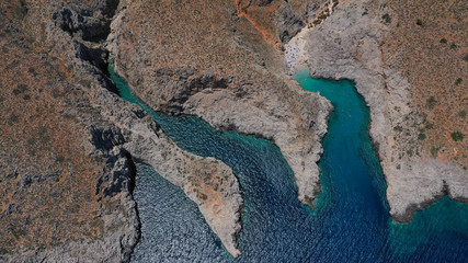 Aerial drone photo of heavenly turquoise rocky beach in shape of fjord of Seitan limania or Agiou Stefanou, Chania - Akrotiri, Crete, Greece