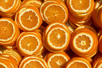 Background of ripe juicy orange slices. The texture of orange.