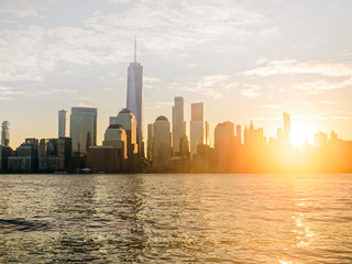 Lower Manhattan at sunrise with lens flare