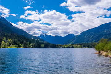 Fototapeta na wymiar Mountain Lake with Blue Sky in British Columbia, Canada.