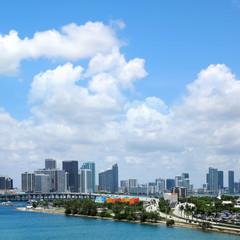 Cityscape of Miami downtown skyline over cloudy blue sky in Miami, Florida, USA
