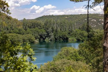 View from tree trail in the National Park of Croatia onto the lake in the mountains