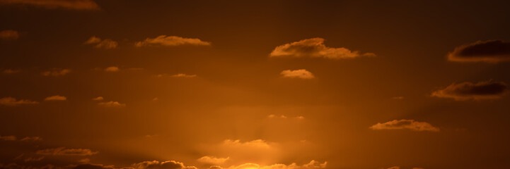 Beatiful sunset above the mediterranean sea. Sunrise with red and orange skies and the sun shining. Bright sun with dark background