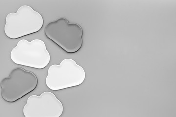 Clouds figures for cloud storage on gray background top view mockup
