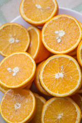 halves of orange oranges lie on a plate