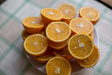 halves of orange oranges lie on a plate