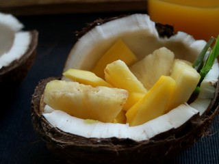 Coconut filled with mango and pineapple 