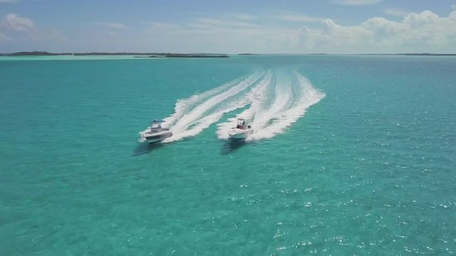 drone bird view of 2 boats in the bahamas. summer vaction