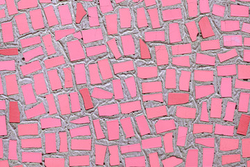 Closeup of pink coloured abstract mosaic ceramic tiles patterned background