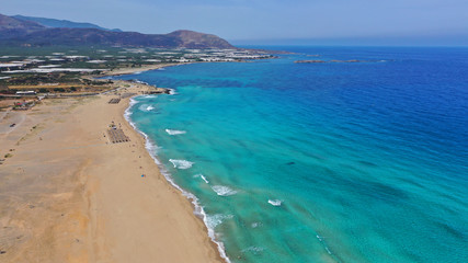 Fototapeta na wymiar Aerial drone top view photo of famous paradise sandy deep turquoise beach of Falasarna in North West Crete island, Greece