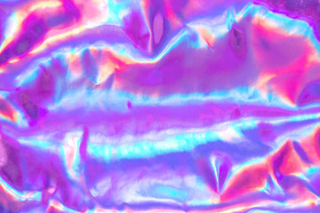 Abstract trendy holographic background. Real texture in violet, pink and mint colors with scratches...