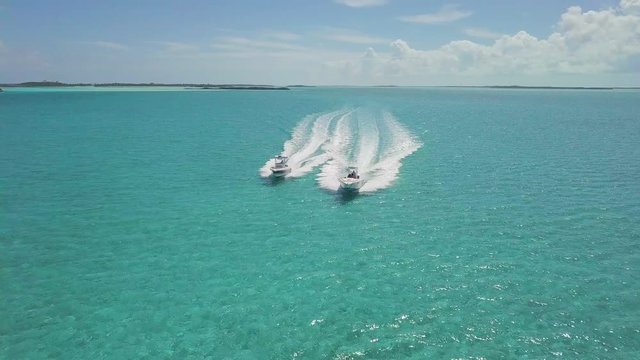 drone bird view of 2 boats in the bahamas. summer vaction