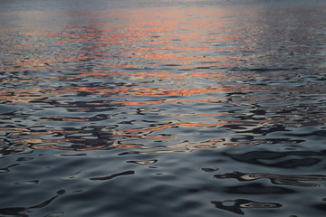 Sunset reflection in ocean water. Close up.