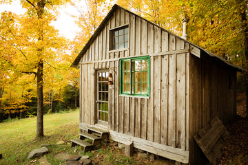 old wooden cabin in autumn