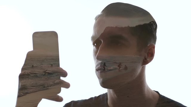 Double exposure of man uses smartphone and beautiful beach. Double exposition of man and sea waves