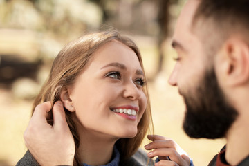 Portrait of cute young couple outdoors, closeup