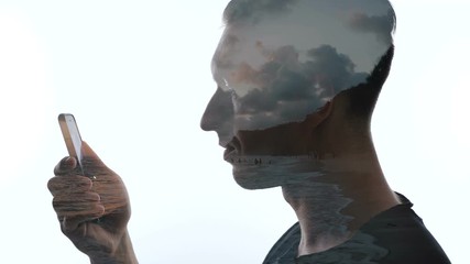 Double exposure of a man looking into a smartphone and a beautiful tropical beach. - Powered by Adobe