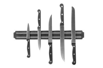 Magnetic holder with different knives isolated on white