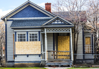 Old Boarded Up Home From Recession