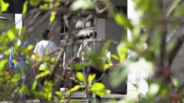 People walking towards a building