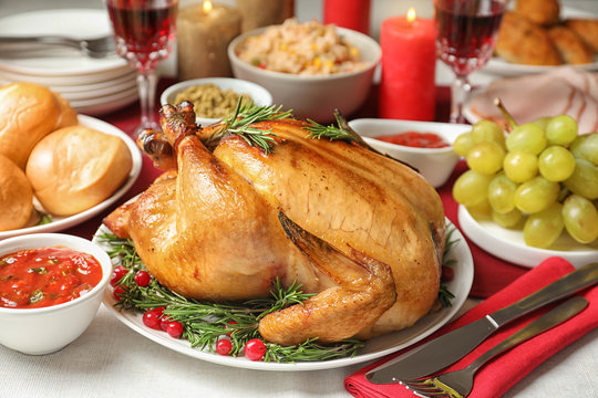 Traditional festive dinner with delicious roasted turkey served on table