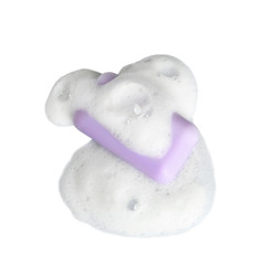 Soap bar and foam on white background