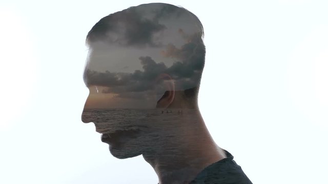 Portrait of pensive man and sea waves - Double exposition