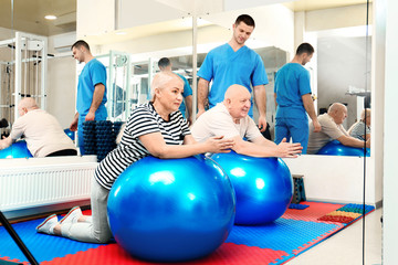 Patients exercising under physiotherapist supervision in rehabilitation center