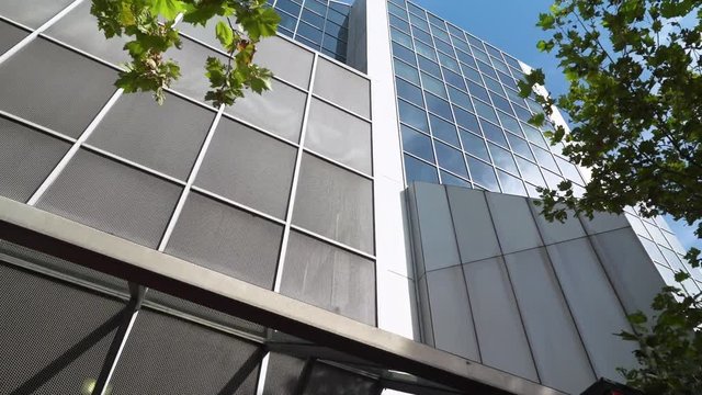 modern office building with reflection in windows