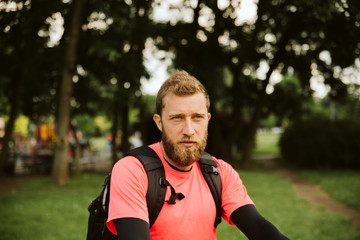 Fototapeta premium Handsome young caucasian goes on hiking