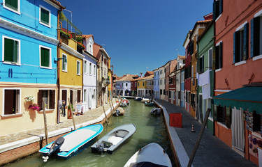Fototapeta na wymiar Burano island canal, colorful houses and boats, Venice Italy Europe