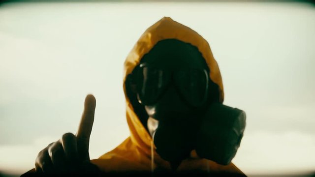 Unknow person under gas mask  passes a security check, passport control