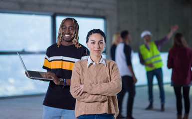 multiethnic business couple on construction site